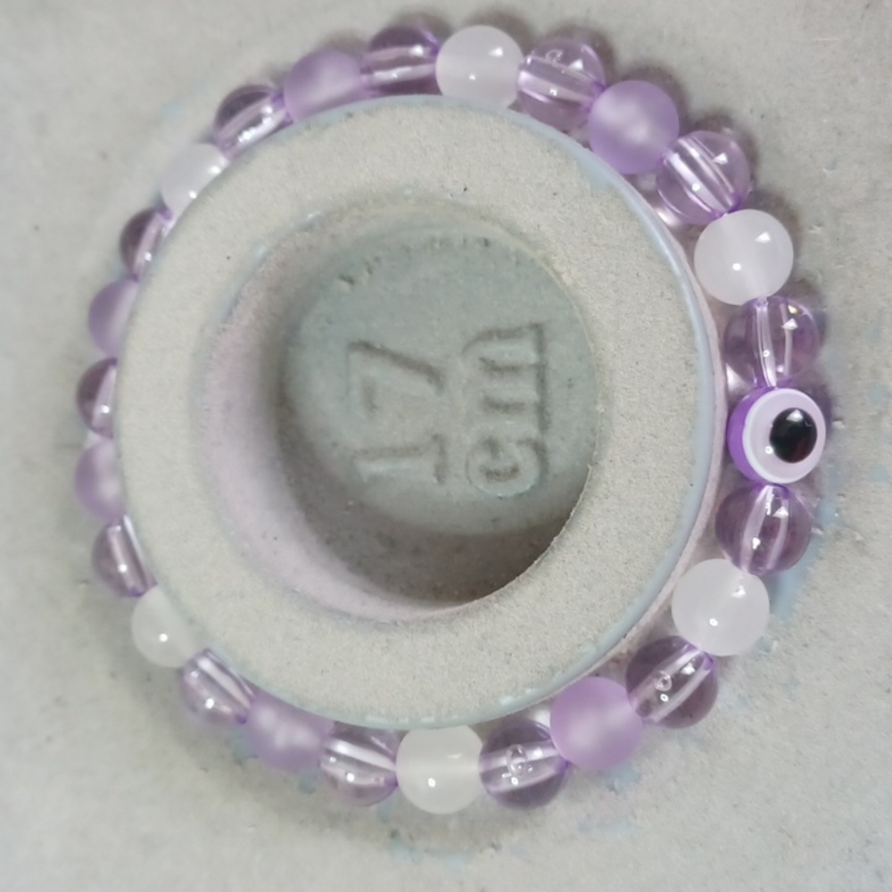Purple white evil eye glass bead bracelet